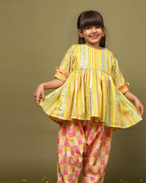 Sun-kissed mirror peplum with dhoti is perfect for festive occasions! Comfortable cotton lining, snap button closure, 3/4 sleeves with frill cuffs, and stylish checkered dhoti with side opening.